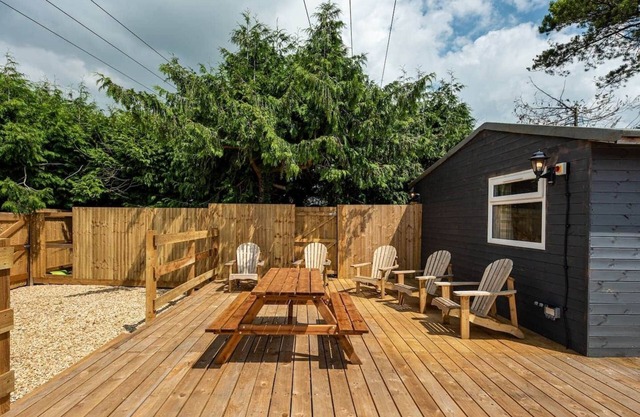 Modern cabins with sunny lounge & deck sleeps 18