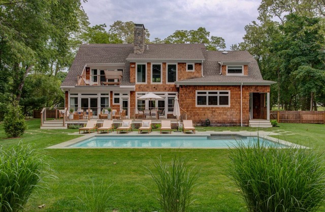 Modern Coastal Farmhouse style home with a private pool, open-floor plan,...