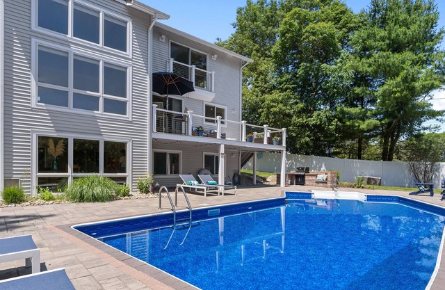 Modern coastal retreat w/ pool, close to beaches and golf courses.