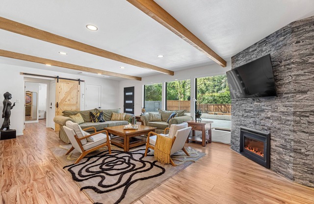 Modern elegance in the redwoods, steps from the magnificent river beach