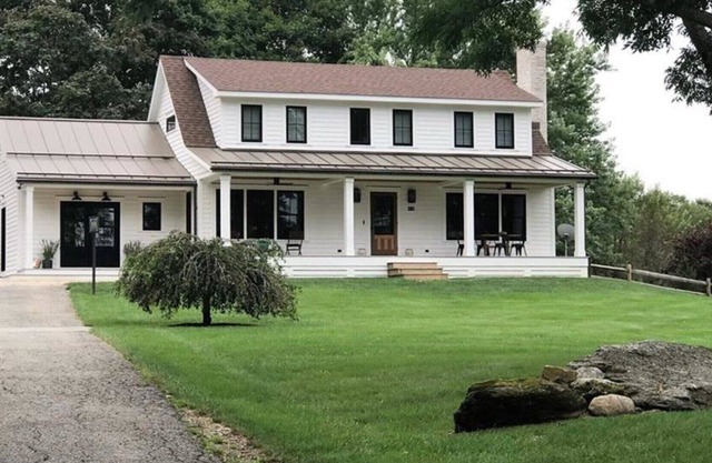Modern farmhouse sited on over 3.5 acres of land, stunning heated pool,...