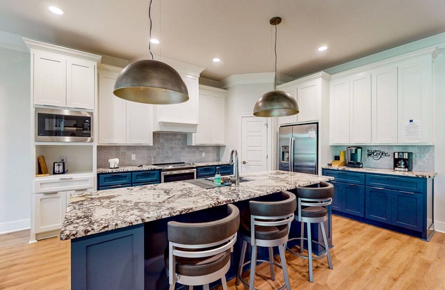 Modern home on golf course with valley views, private putting green, & fireplace