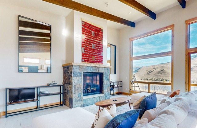Modern home overlooking mountain & lake views - luxury interior and balcony