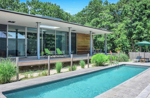 Modern home sited on a lush wood acre, stunning pool, covered deck, outdoor...
