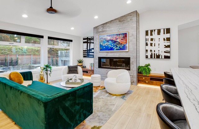Modern home with outdoor fireplace, rock-wall, & walk-in shower