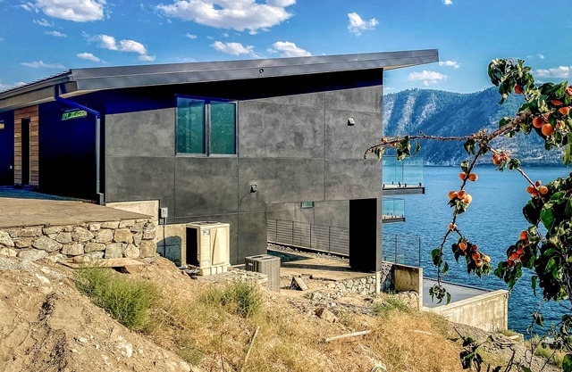 Modern lake house w/waterfront access, lake views & mid-century modern touches.