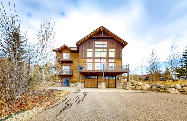 Modern mountain view home with balconies, Ping-Pong table, grill, & fireplace