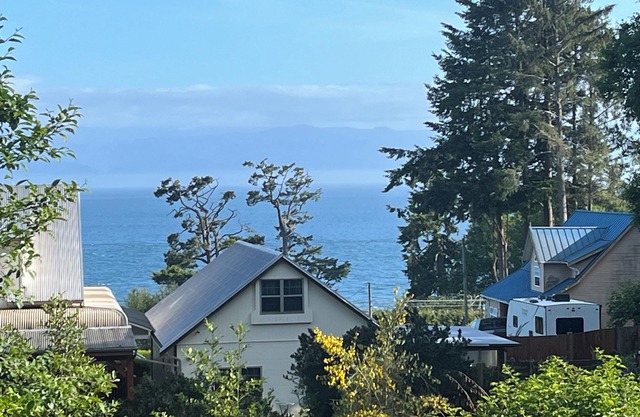 Modern ocean view suite with large private deck, located on a small hobby farm.