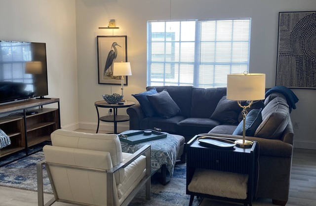 MODERN RETREAT: 2/2, w/private study, garage, screened patio, and front porch.