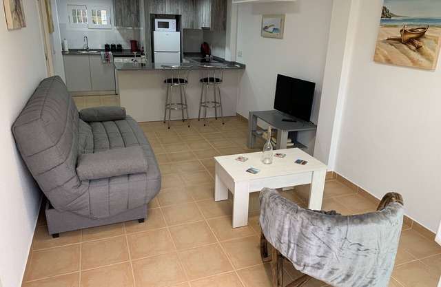 Modern south facing Apartment with Sun Terrace 10 minute walk to sandy beach.
