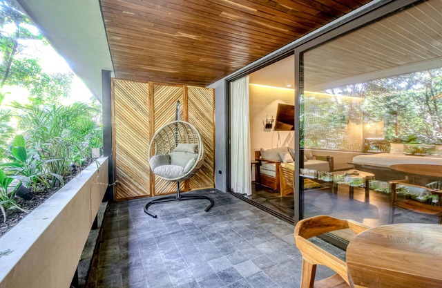 Modern second floor studio with pool, partial AC, and balcony