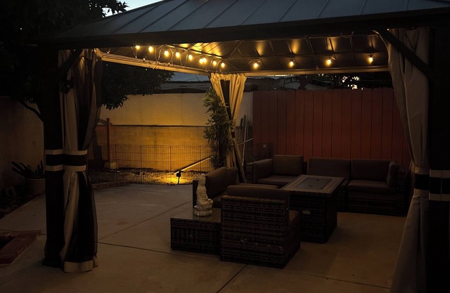 Modern studio with Backyard Gazebo and Firepit