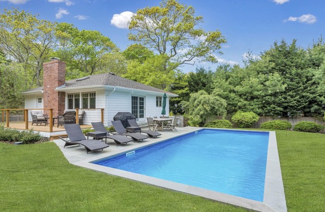 Modern-style home with private pool, open-floor living plan, back porch,...