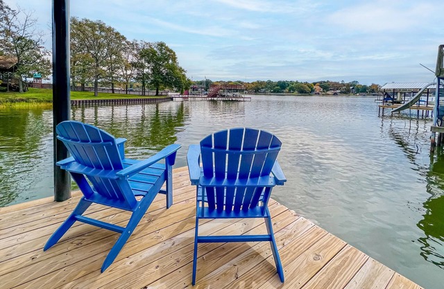 Modern waterfront home with beautiful cove views, kayaks, grill, firepit & dock