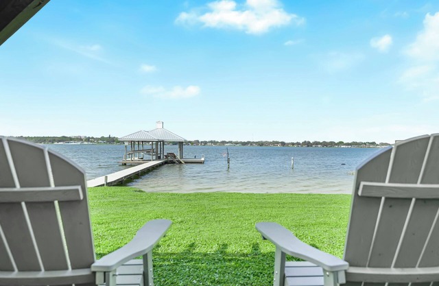 Modern Waterfront Lakehouse, with a private beach and a spacious boat dock.