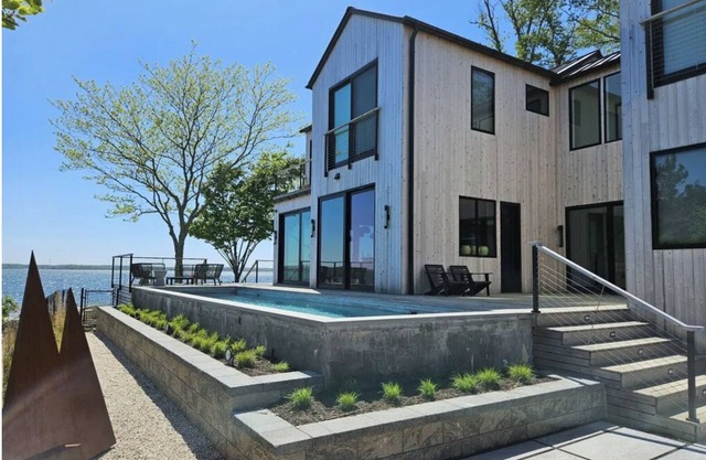 Modern Zen beach oasis with pool in Jamesport Bay.
