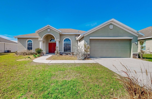 Modernly updated open home with lake view, screened-in patio, grill, AC, & W/D