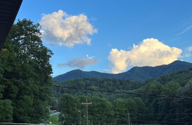 Mountain retreat with large deck with a beautiful mountain view.