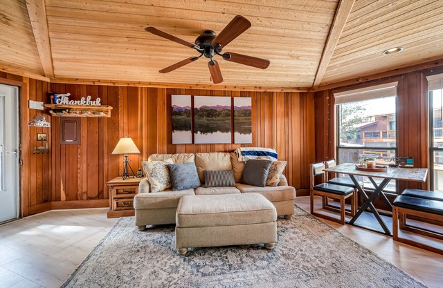 Mountain-view condo with pool, fireplace, gym, games & balcony