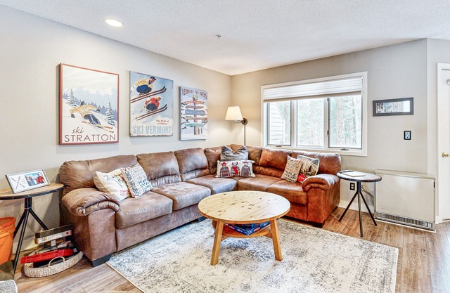 Mountain-view condo with private balcony, fireplace, & updated interior