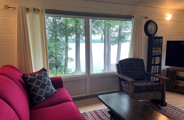 Discover lakeside living with cozy 3 bedroom cottage with Muskoka room