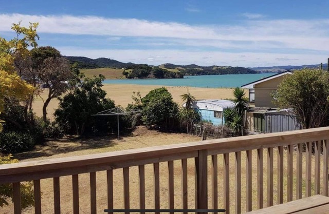 Beach to the left, Harbour to the right. Room for 2 families, seperate cabin