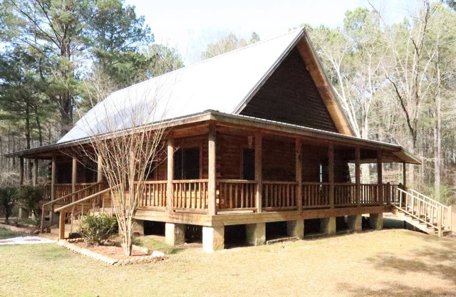 *New Listing Limited Time Price Special* Log Cabin retreat on 40 acres of pine forest