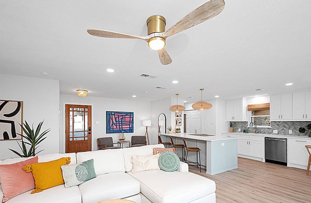 NEW LISTING! Stunning remodeled lakeside retreat with putting green and beach!