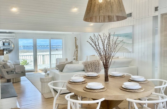 NEW TO MARKET! Stunning Dune Road bay front, steps to private ocean access!