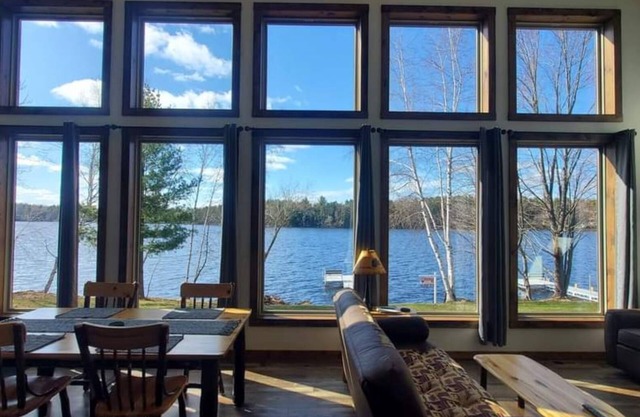 New waterfront cabin with expansive lake-facing windows, Long Lake, Phillips
