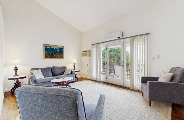 Newly-furnished condo with loft, fast WiFi, partial AC, grills & yard access