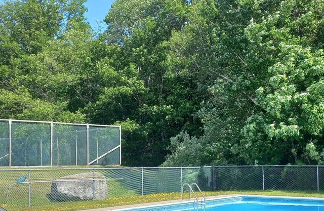 Newly renovated townhouse with tennis court and pool.