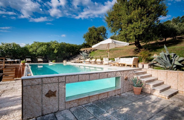 Oasi Dolce Vita house surrounded by greenery with swimming pool, tennis and panoramic view
