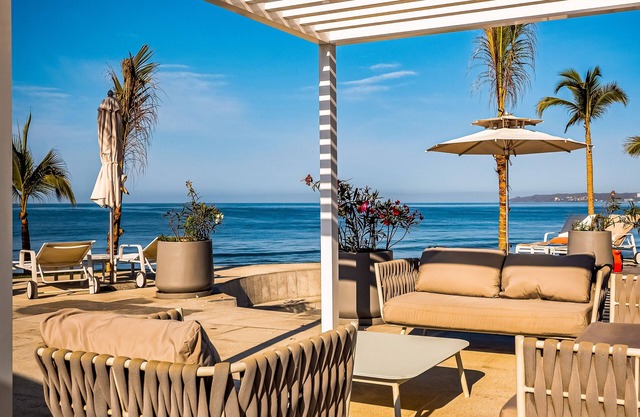 Ocean-view 5th-floor condo with 4 pools, sauna, steam room, huge balcony, & gym