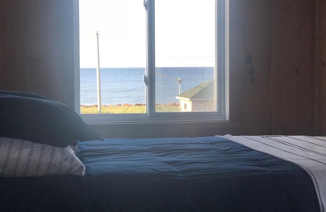 Ocean view cottage, steps from beautiful north shore beach.