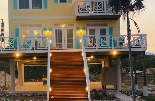 Oceanfront brand new home with large deck and BBQ. Steps away from sandy beach!