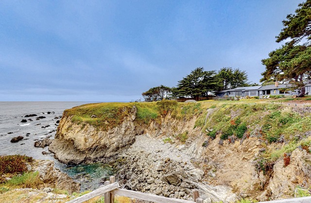 Oceanfront home steps to the beach with impressive ocean & cove views & deck