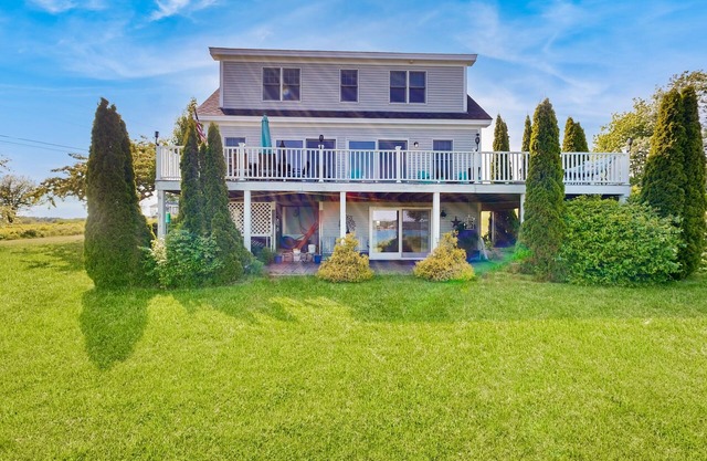 Oceanfront home with dock, beautiful deck & firepit - steps to the beach
