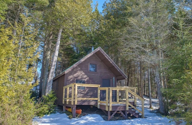 Off grid home with a cabin on a private lake