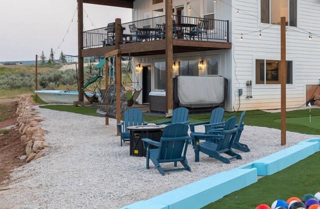 On Hole 9 of Bear Lake Golf Course! Ideal Beach Access! Private Hot Tub. Sky Swings, and Ping Pong!