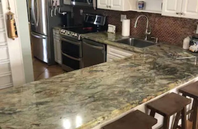 On the water luxury bay-side condo, sunset views, top floor, and many amenities.