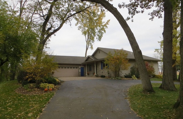 One bedroom and full bath in home 2 miles from EAA. Area with TV & refrigerator.