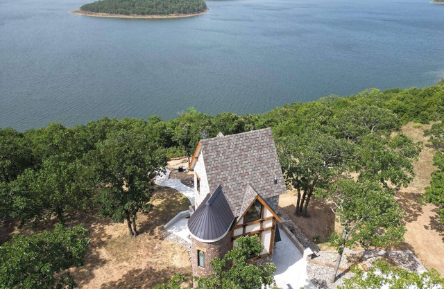 One of a kind Castle on picturesque Skiatook Lake with a Rapunzel exterior look
