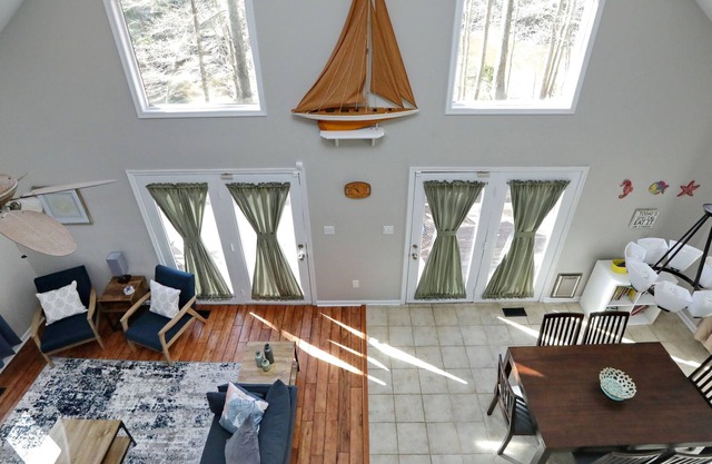 One of a kind waterfront house with pond/creek, deck, privacy and beach access.