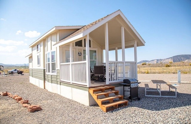 Our largest "not so tiny" tiny home, White River Casita is a beautiful modern tiny home that features a Queen bed on main level, one Queen bed in loft accessible by stairs, one Queen fold out couch with additional sleeping space in loft for sleeping