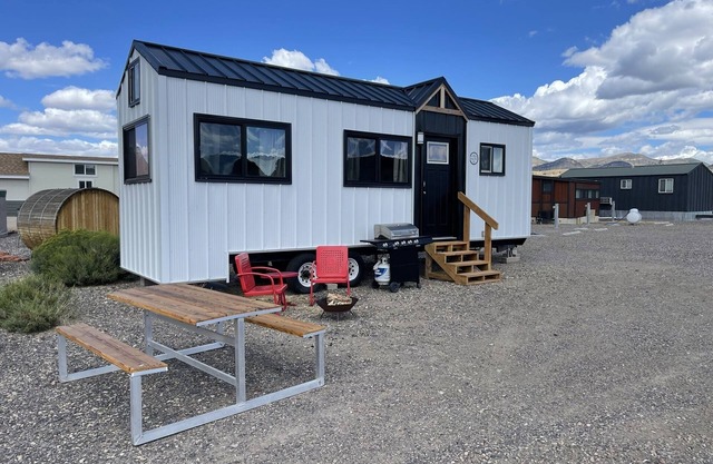 Our newest and one of our largest tiny homes contains a queen bed on the main level and two queen lofted beds. Sleeps: 6