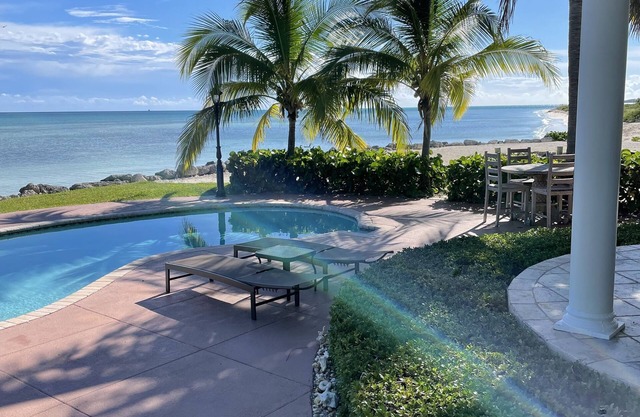 Paradise is Due South! One level main house and 2 story complete guest house.