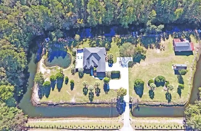 Paradise Palms surrounded by man made mote in Manning, South Carolina!