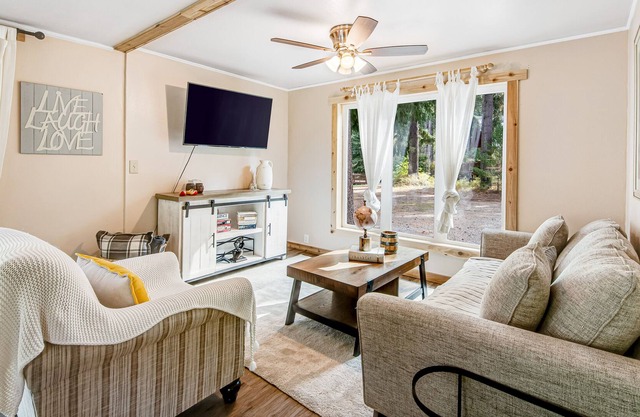 Peaceful, Riverfront, Dog-friendly Home w/ Covered Deck & Outdoor Fire Place!