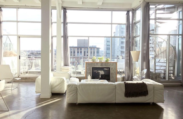 Penthouse loft with deck, rooftop and fireplace in historic Gastown, Vancouver.